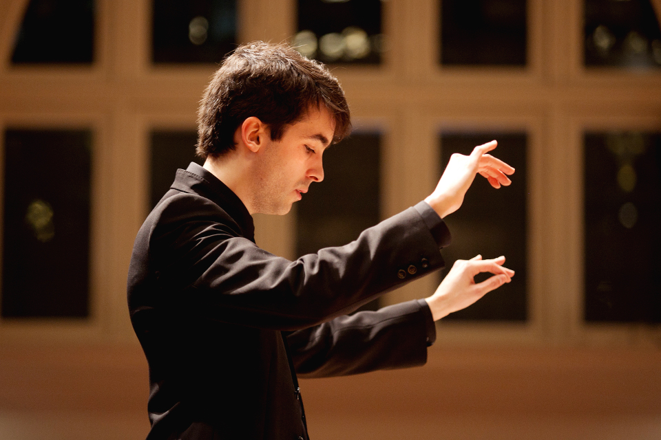 Postgraduate student Asier Puga conducting during a public performance in the Amaryllis Fleming Concert Hall